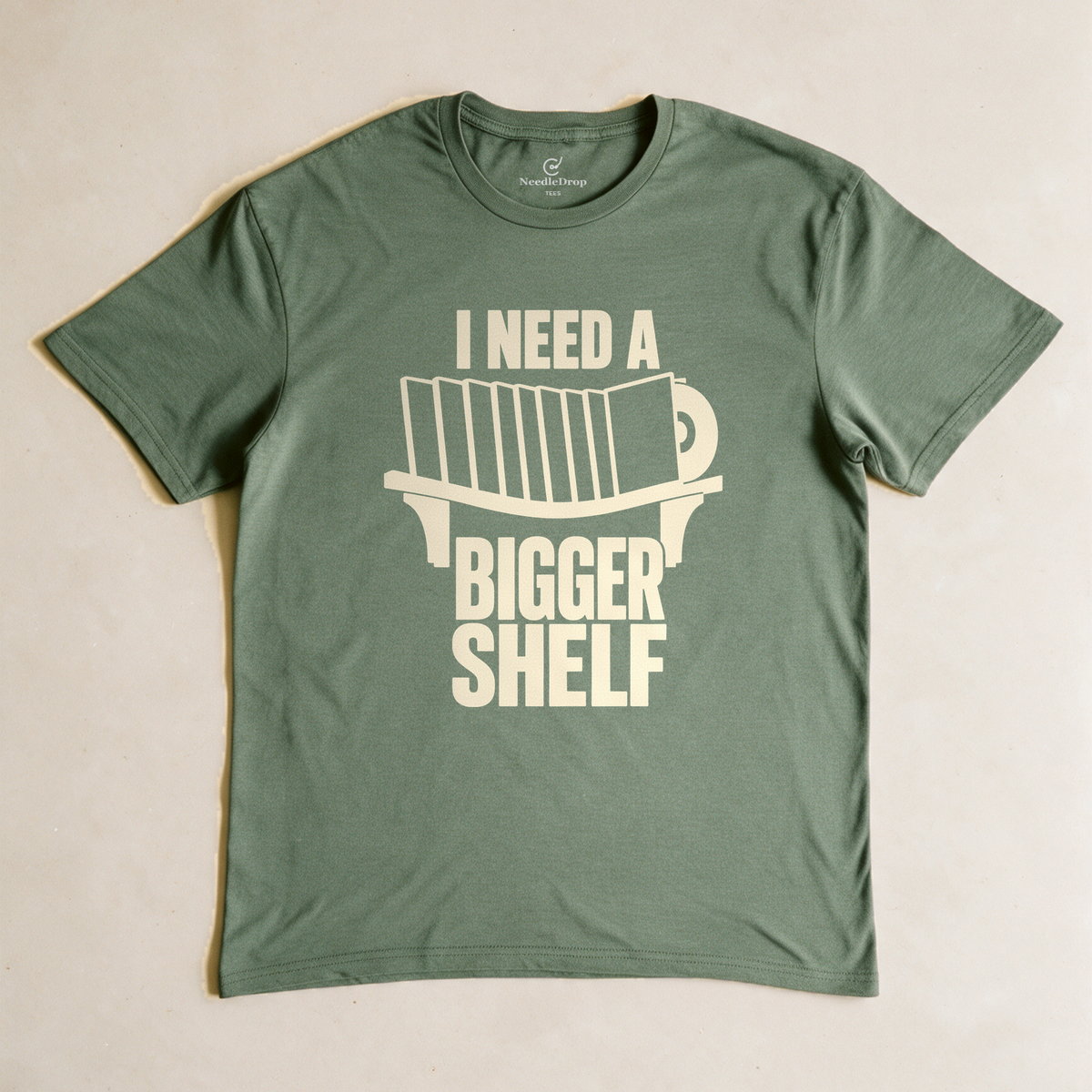 I Need a Bigger Shelf Tee - Military Green flatlay