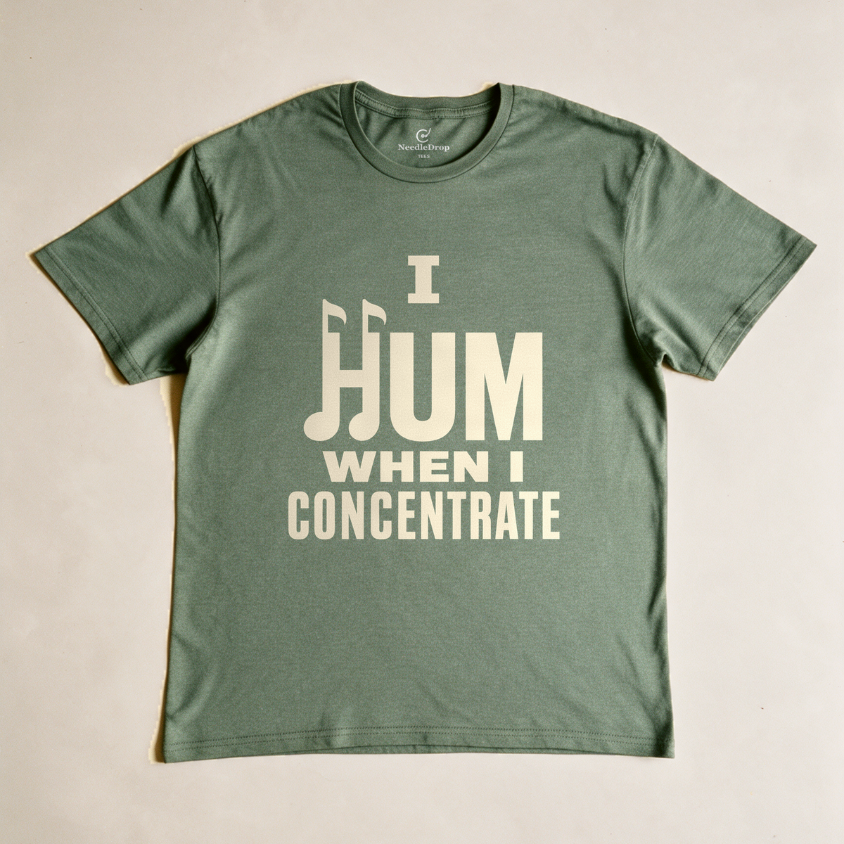 I Hum When I Concentrate Tee - Military Green flatlay