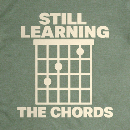 Still Learning the Chords Tee - Military Green close-up print