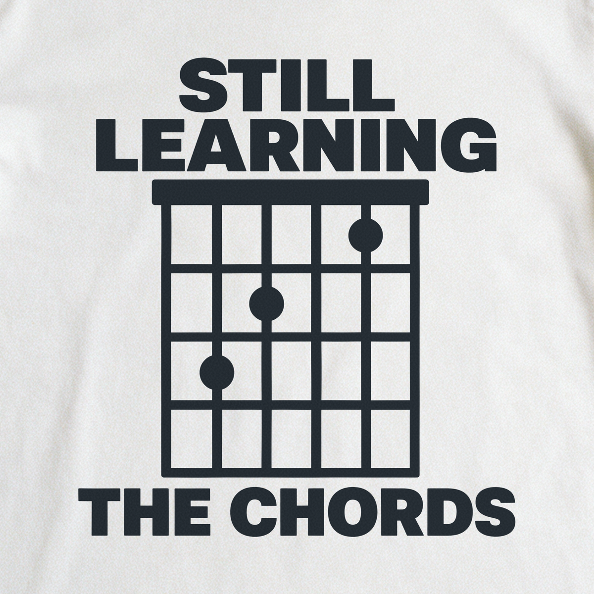 Still Learning the Chords Tee - White close-up print