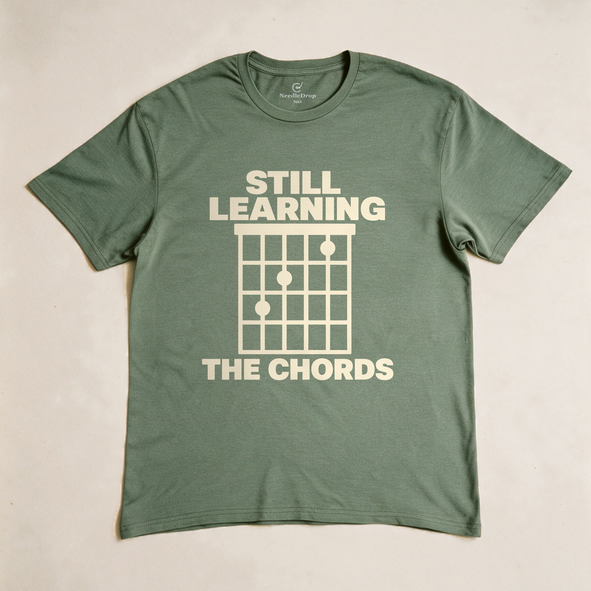 Still Learning the Chords Tee - Military Green flatlay
