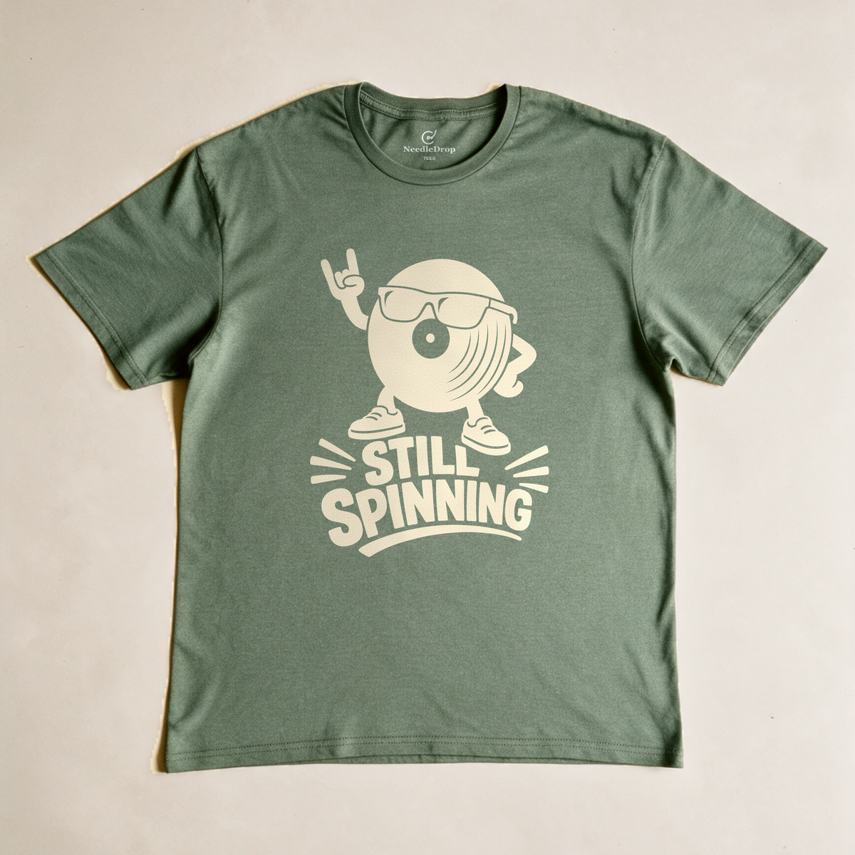 Still Spinning Tee - Military Green flatlay
