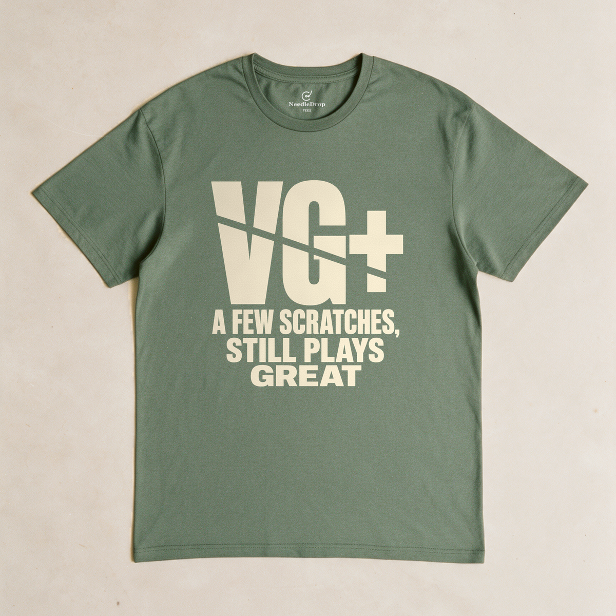 VG+ Still Plays Great Tee - Military Green flatlay