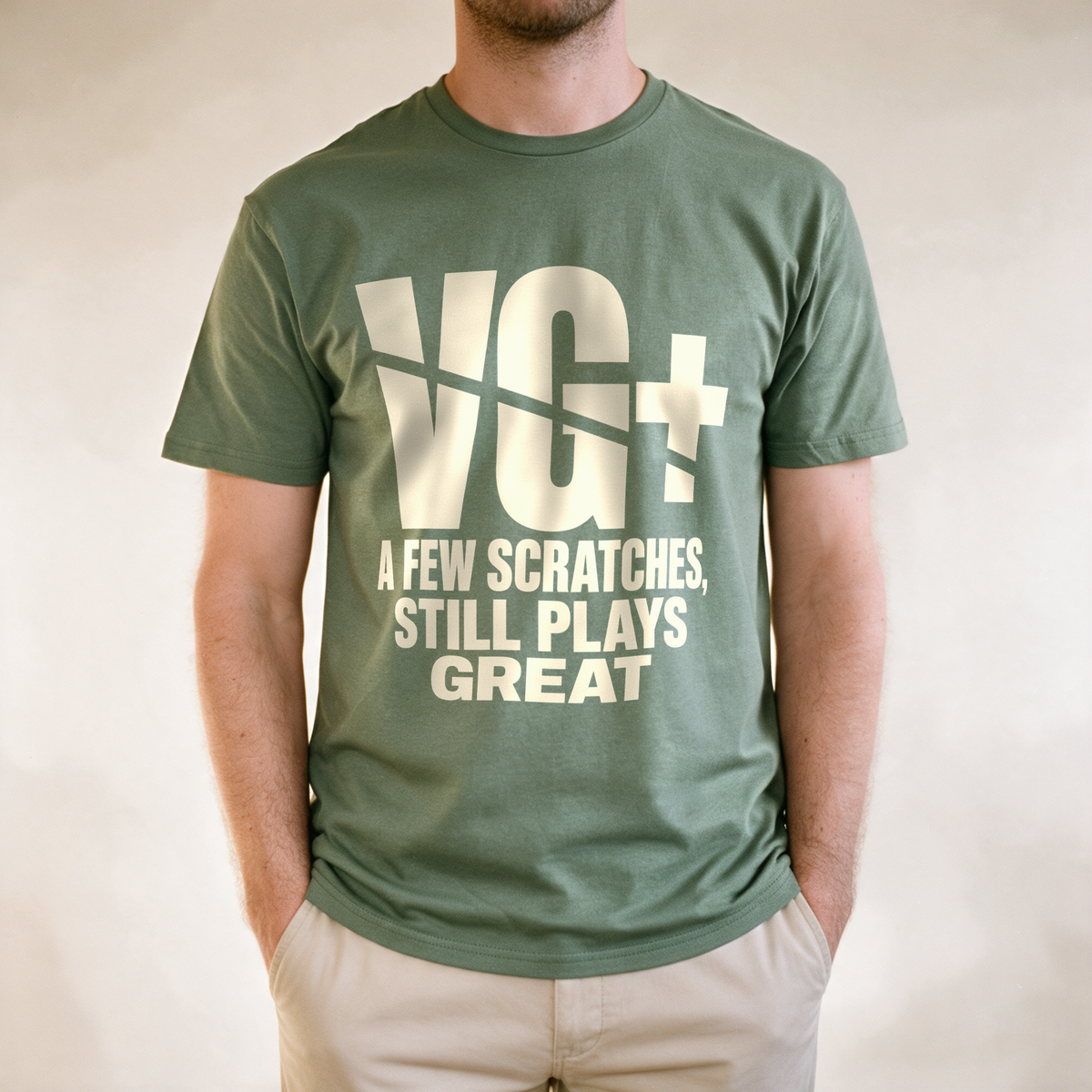 VG+ Still Plays Great Tee - Military Green draagfoto